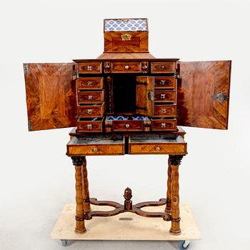 A first half of the 18th century walnut cabinet.