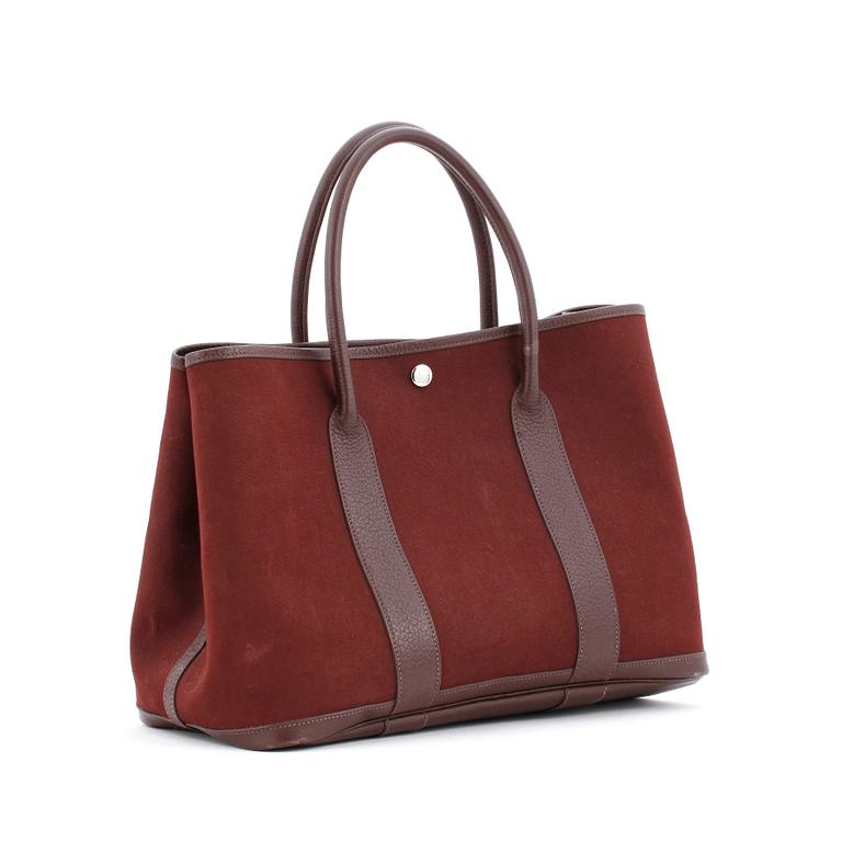 HERMÈS, a brown canvas and leather bag, "Garden Party".