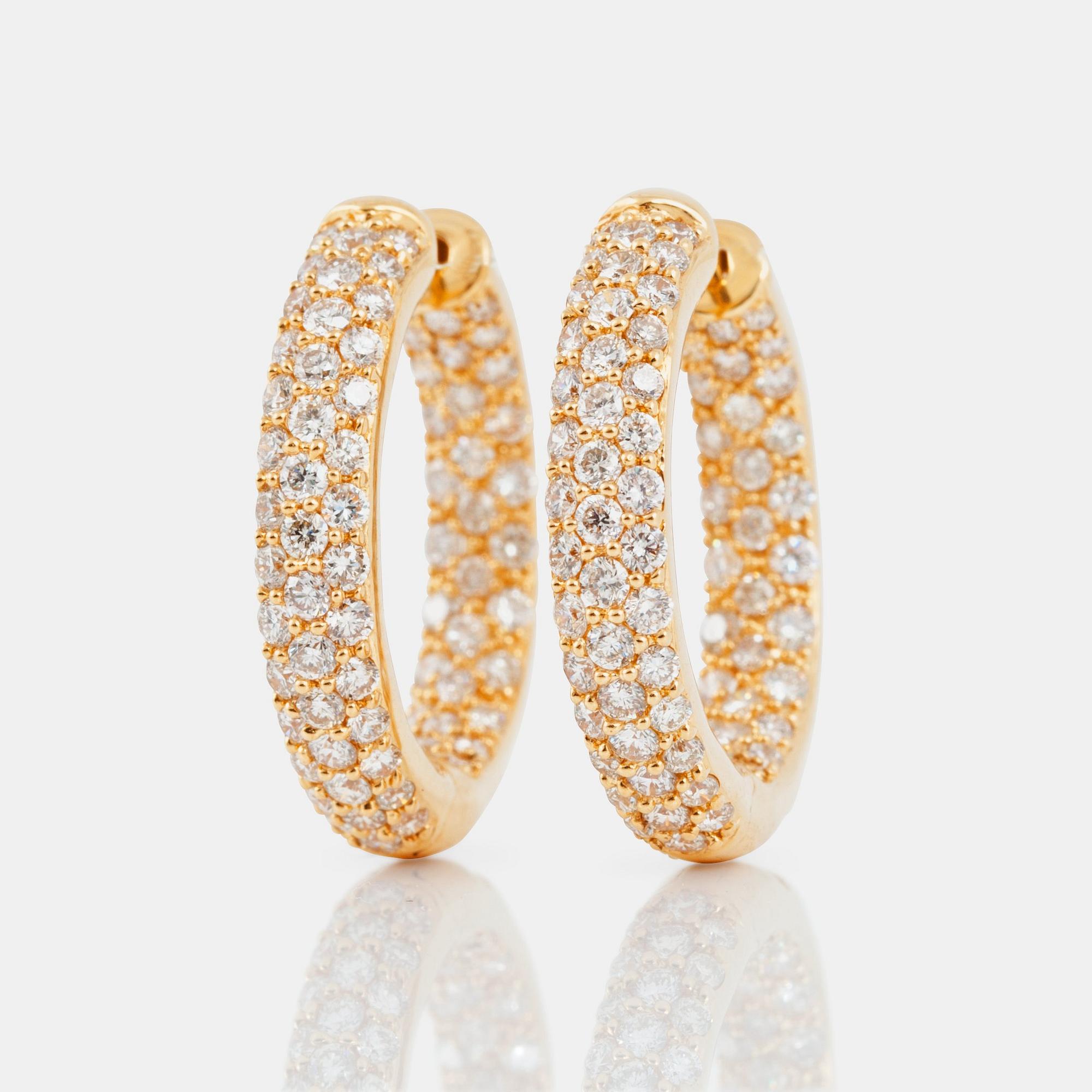 A pair of diamond hoop earrings, 2.65 cts according to engraving.