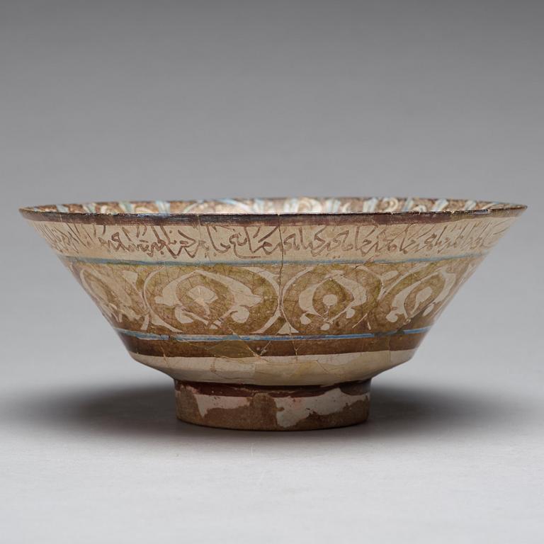 A BOWL, pottery with luster decor and blue, height ca 10 cm, diameter ca 23,5 cm, Kashan style, Persia/Iran 13th.