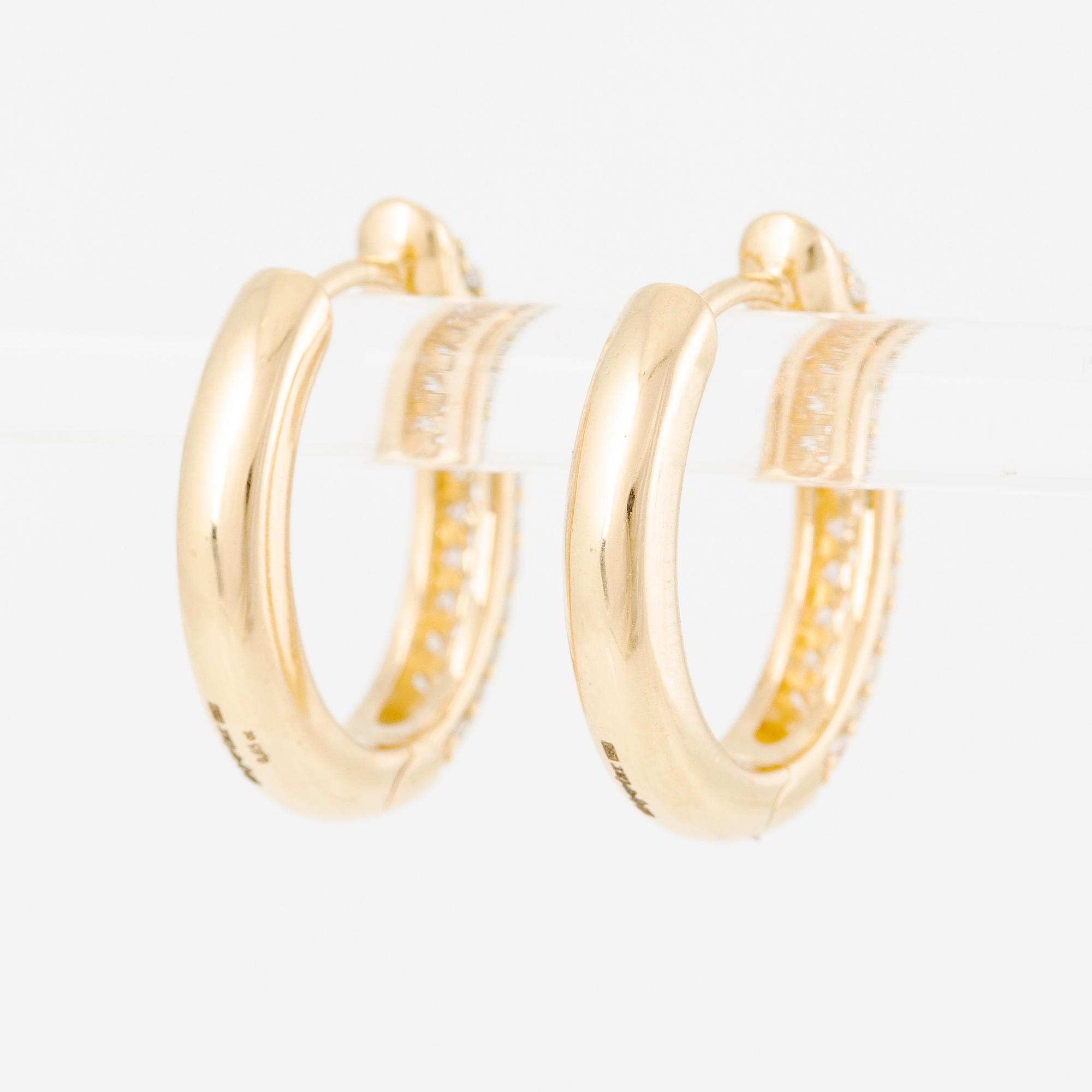 Hoop earrings in 18K gold set with brilliant-cut diamonds.
