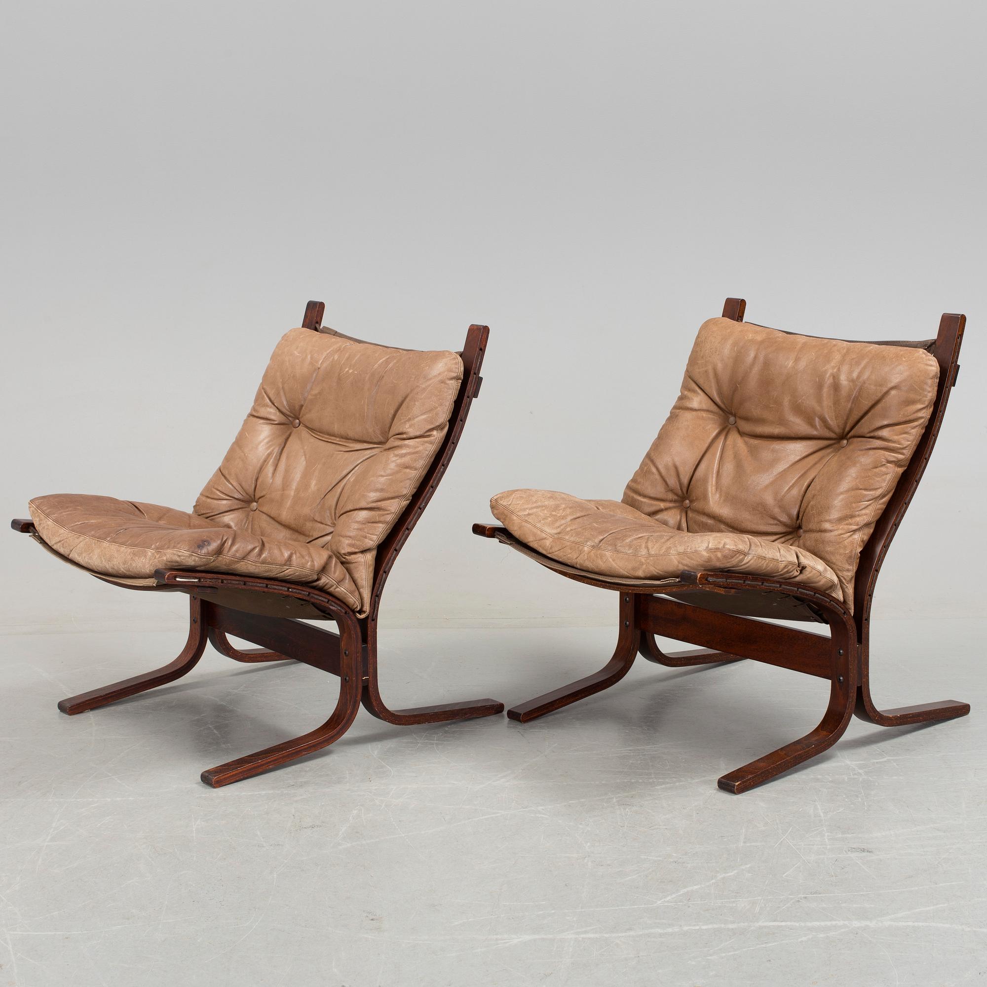 A pair of 1970s "Siesta", easy chairs and sofa tables by Ingmar Relling, Norge.