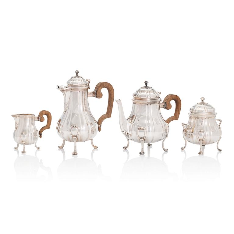 A French four-piece silver coffee and tea set, mark of Emile Puiforcat, Paris, first quarter of the 20th century.