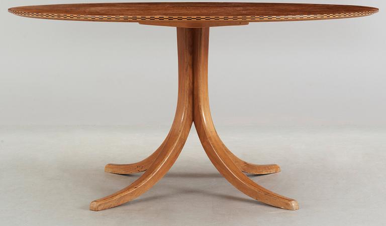 A Josef Frank mahogany and burrwood dining table, Svenskt Tenn, model 1020, checkered edges.