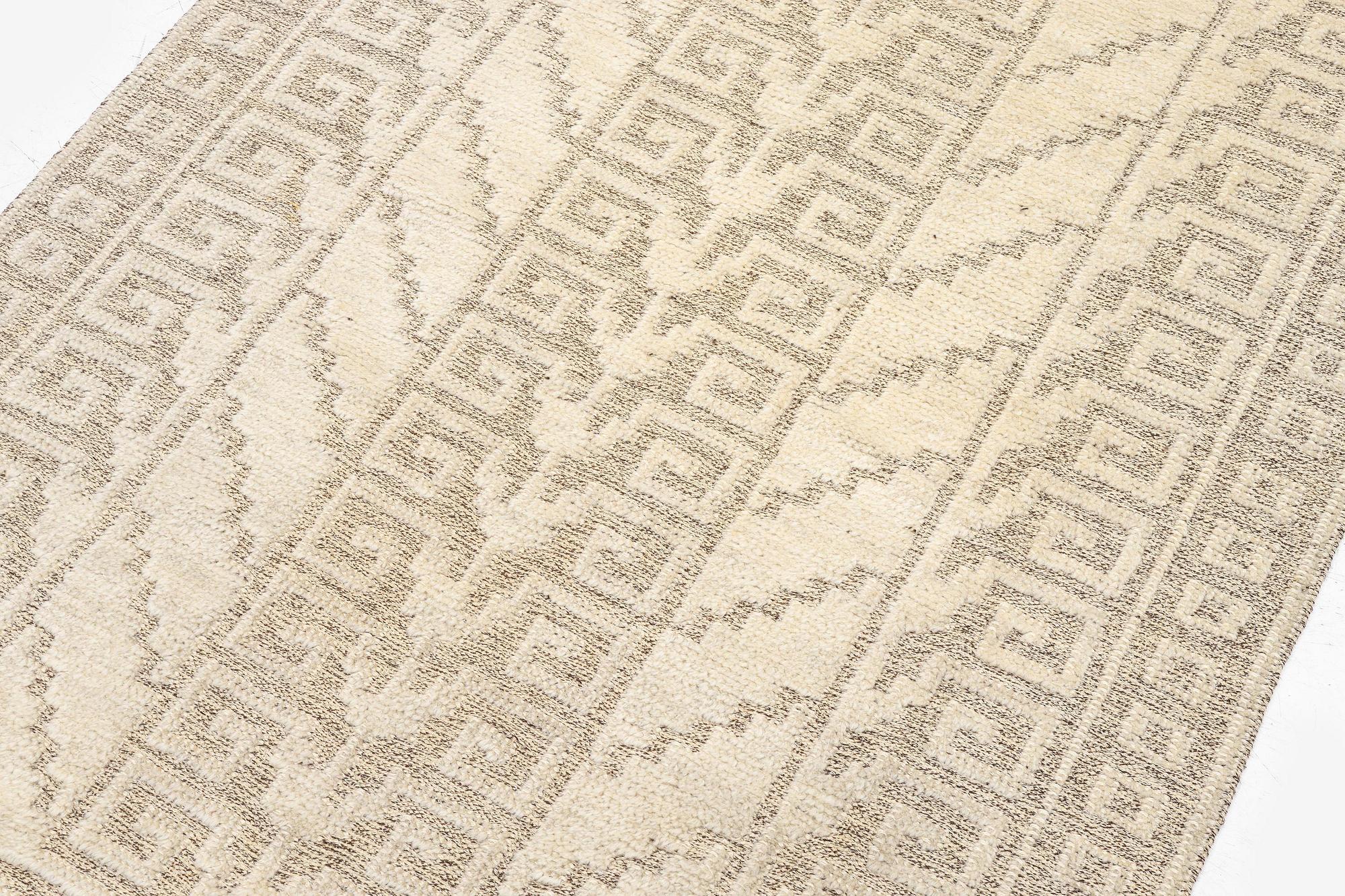 Märta Måås-Fjetterström, a 'Vita spetsporten' carpet, knotted pile in relief, c. 225 x 136 cm. signed AB MMF.