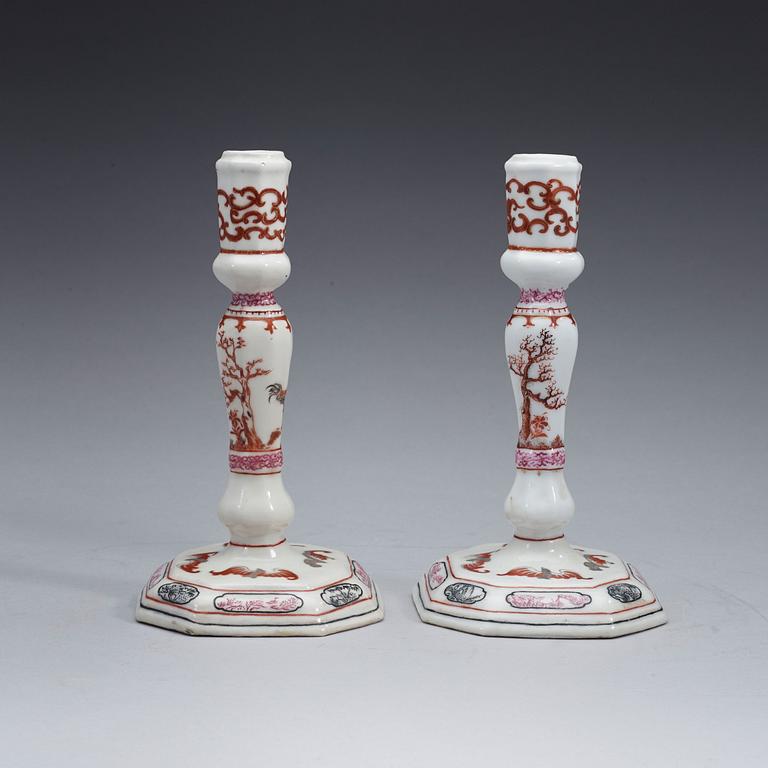 A pair of famille rose candle sticks, Qing dynasty, Qianlong (1736-95).