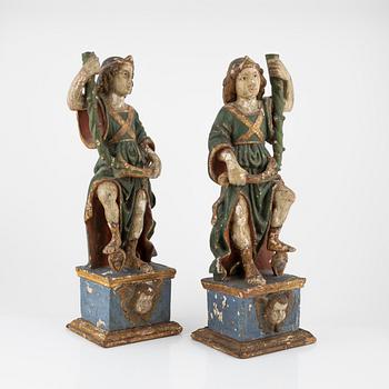 A pair of carved and polychrome painted sacral sculptures, 18th century,