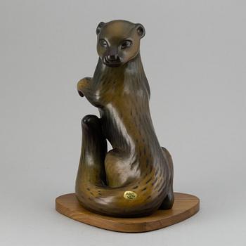 GUNNAR NYLUND, a stoneware sculpture of an otter, Rörstrand, Sweden.