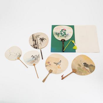 A set of six fans and two umbrellas and a wig/pony tail. Japan, early 20th Century.