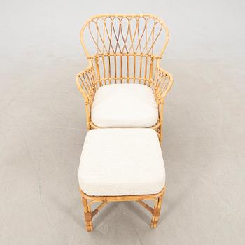 Josef Frank, wicker chair with stool model no. B 311 for Svenskt Tenn, second half of the 20th century.