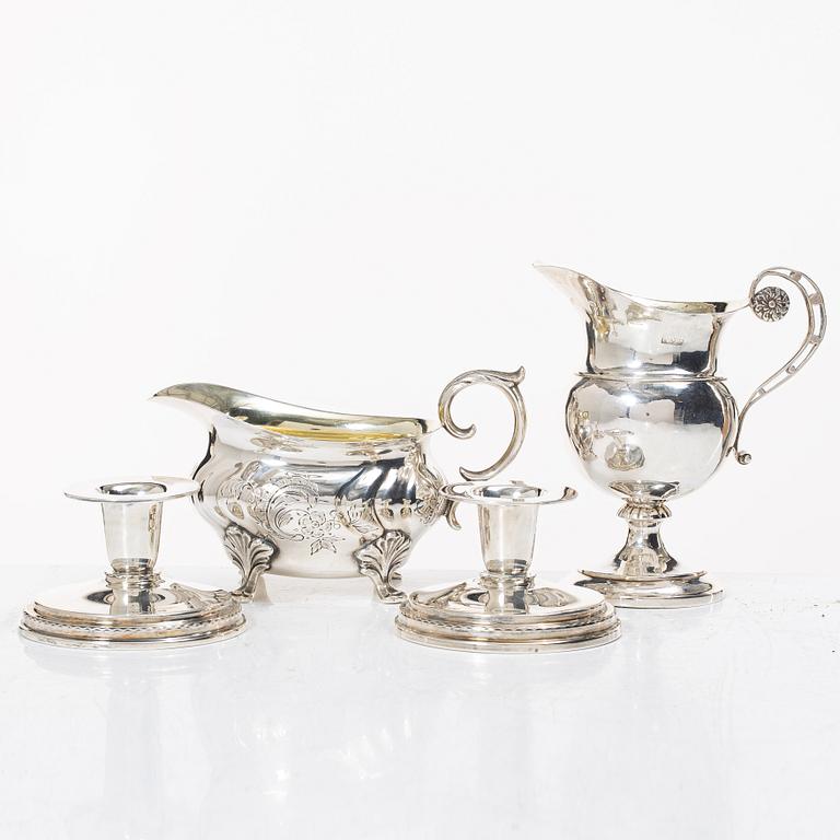 Two jugs and a pair of candlesticks, CG Hallberg among others.