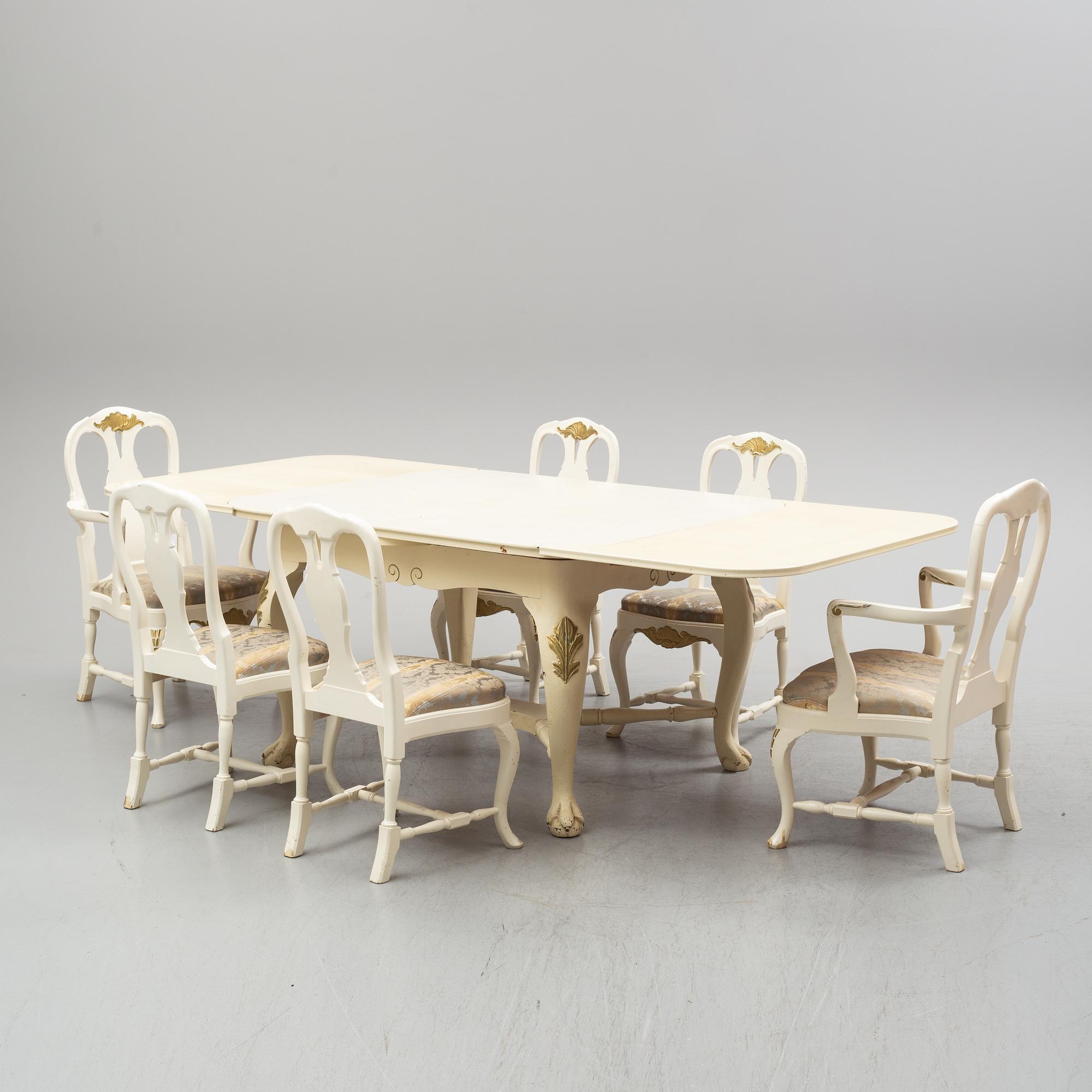 A dining table and six chairs, rococo style, mid 20th century.