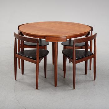 HANS OLSEN, a teak dining table with four chairs from Frem Røjle, Denmark, 1950’s.