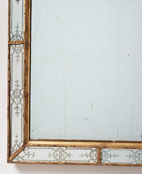 A Baroque gilt-lead and engraved glass mirror in the manner of Burchard Precht, early 18th century.