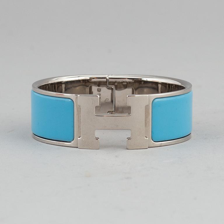 HERMÈS, a 'Clic H' bangle.