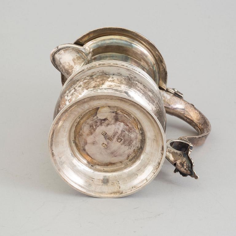 A Silver jug, possibly John Munns dated 1772.