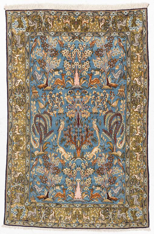 A Ghom figural rug, c. 202 x 132 cm.