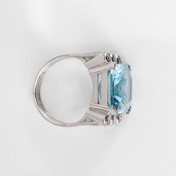 An aquamarine and brilliant-cut diamond ring.