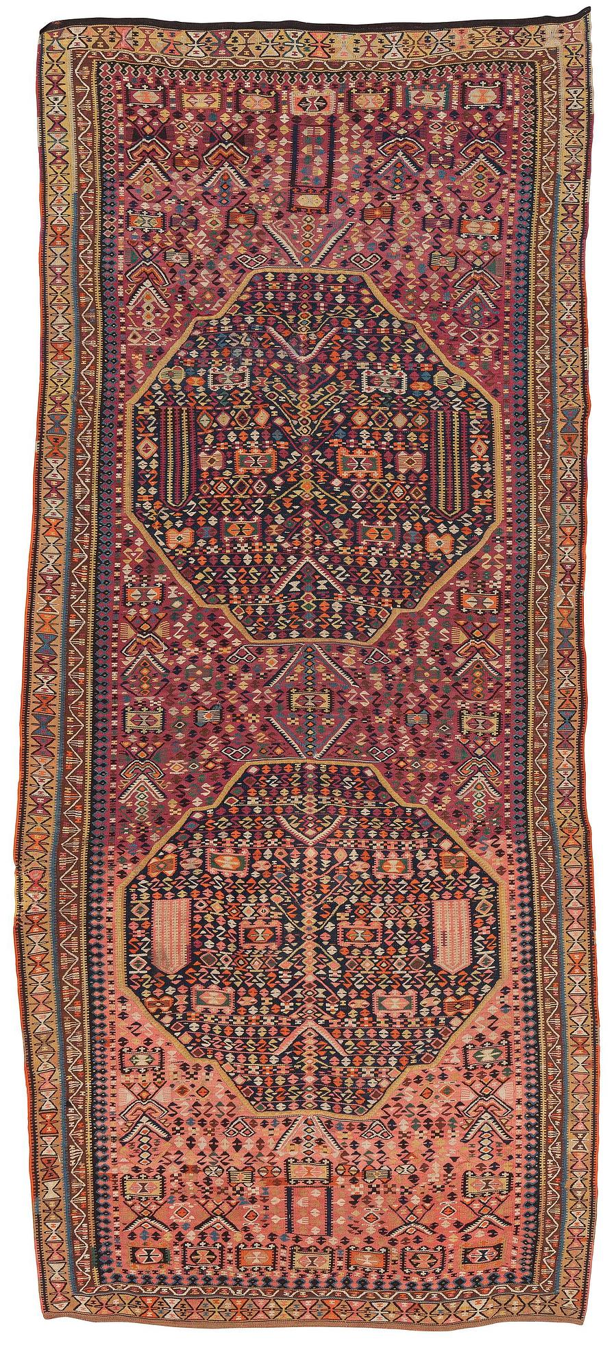 An antique kilim, southeastern Anatolia/Caucasus, c. 398 x 176 cm.