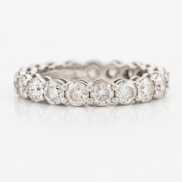 A platinum Tiffany & Co eternity ring set with round brilliant-cut diamonds.