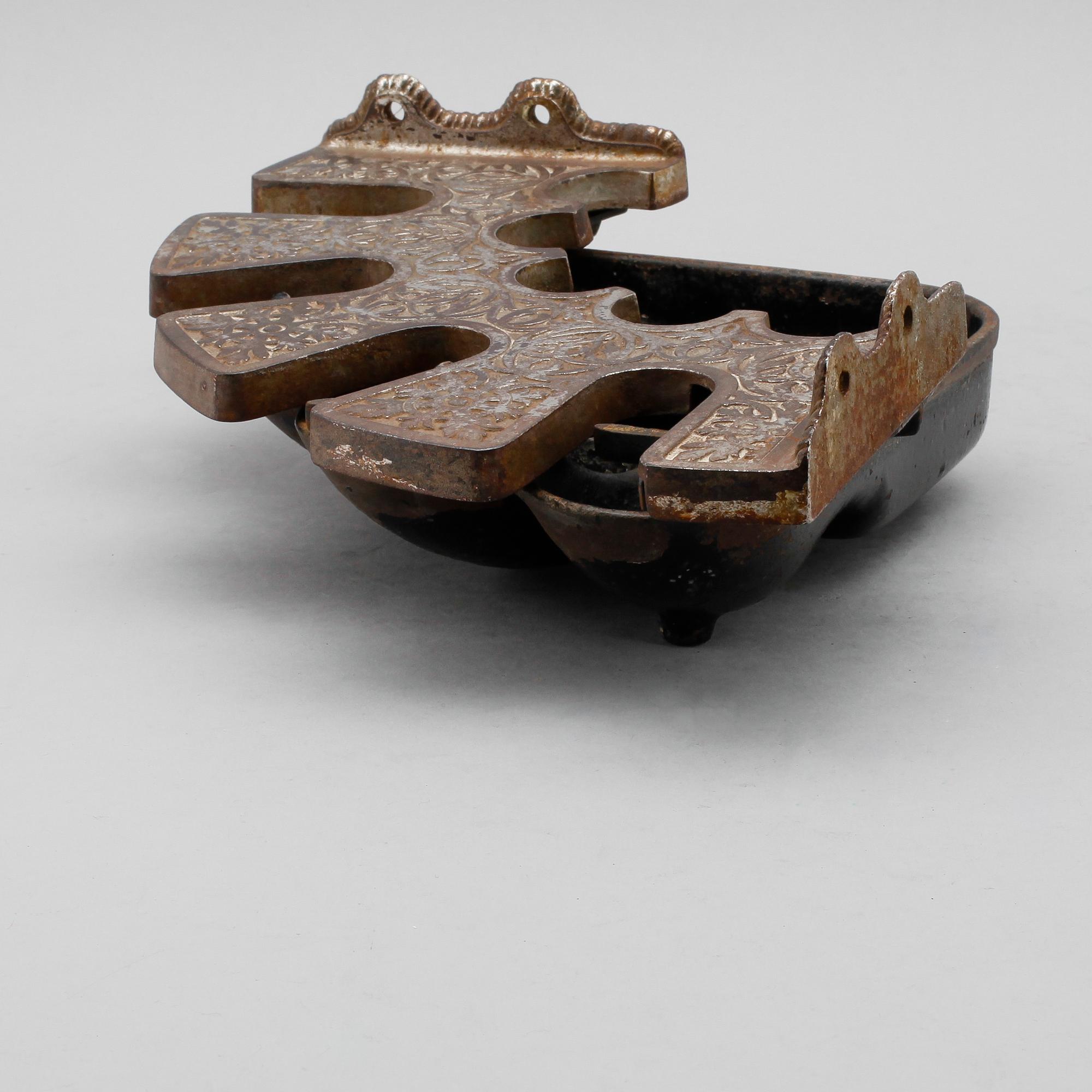 PARAPLYSTÄLL, gjutjärn och vitmetall, omkring år 1900.