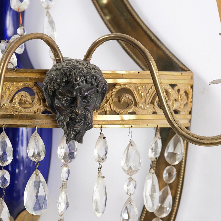 A pair of Russian Louis XVI-style  four-branch gilt bronze appliques, 19th century.