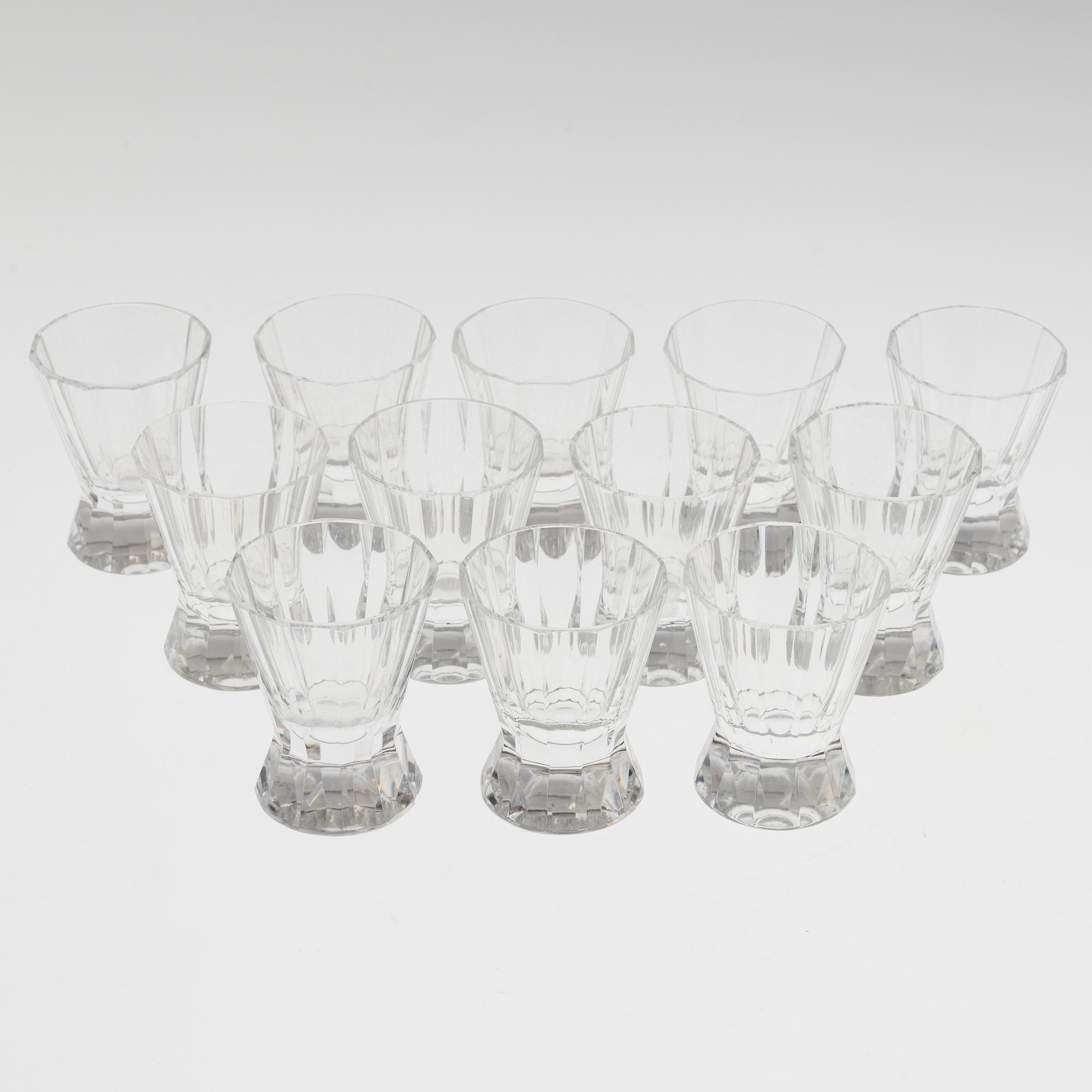 A set of twelve glasses and a cocktailshaker by Elis Berg, Kosta.