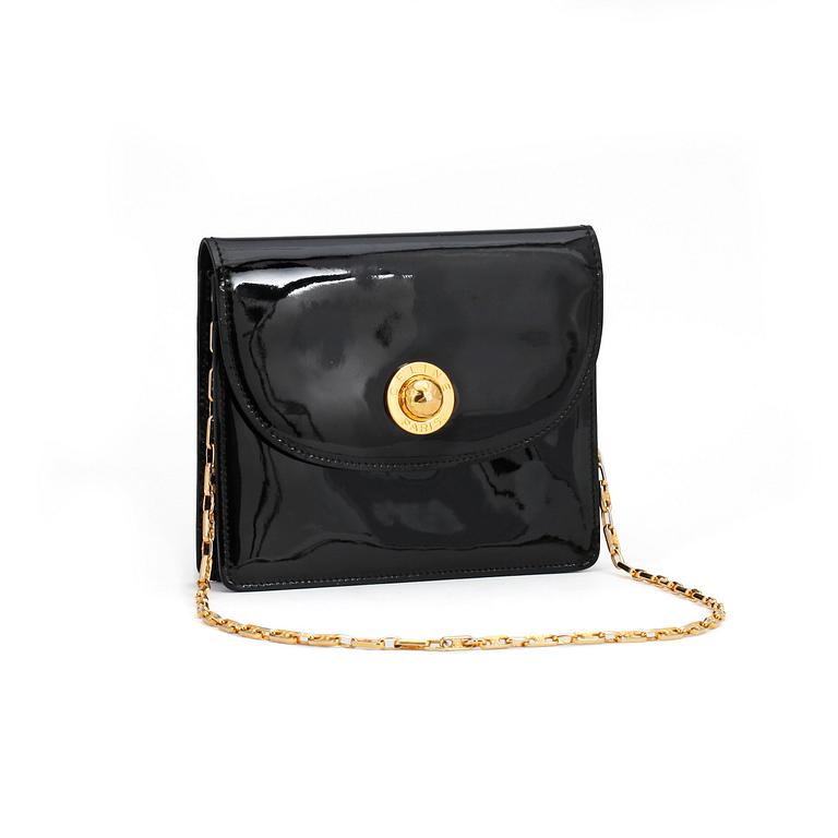 CÉLINE, a black patent leather bag.