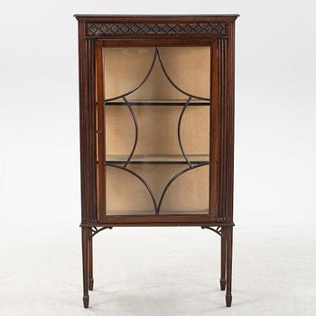 A mahogany vitrine cabinet from around the year.