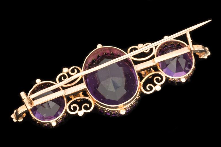 A Victorian amethyst and pearl brooch.