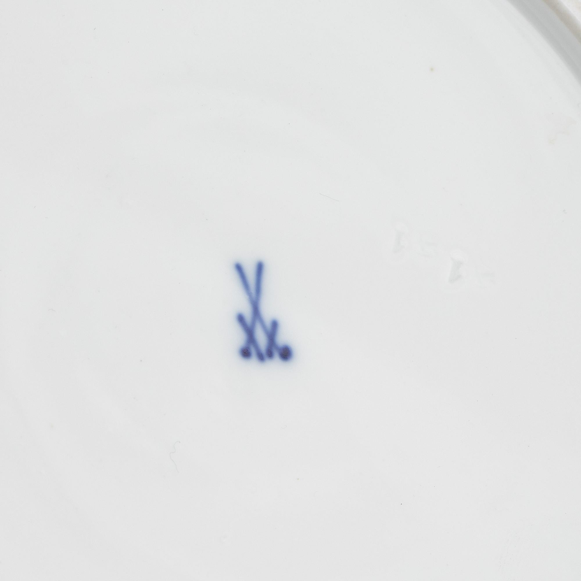 A set of five Meissen porcelain games plates, late 19th to early 20th century.