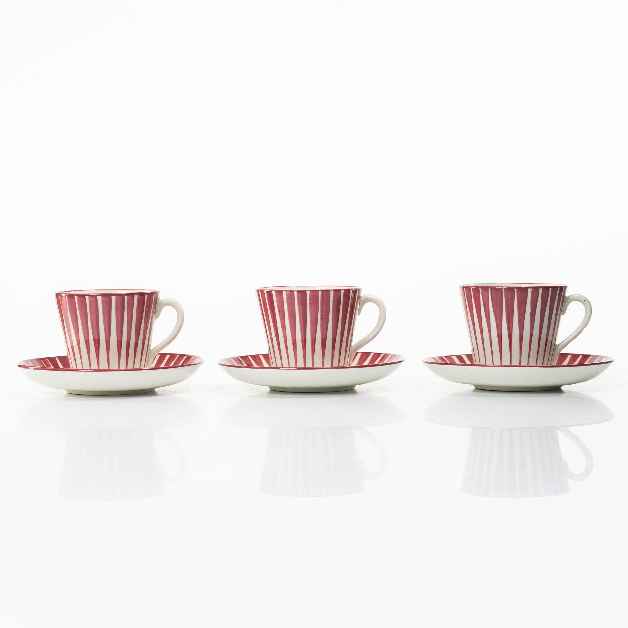 Eugen Trost, Three 'Red Zebra' cream-ware coffee cups on saucers, Uppsala-Ekeby Gefle.