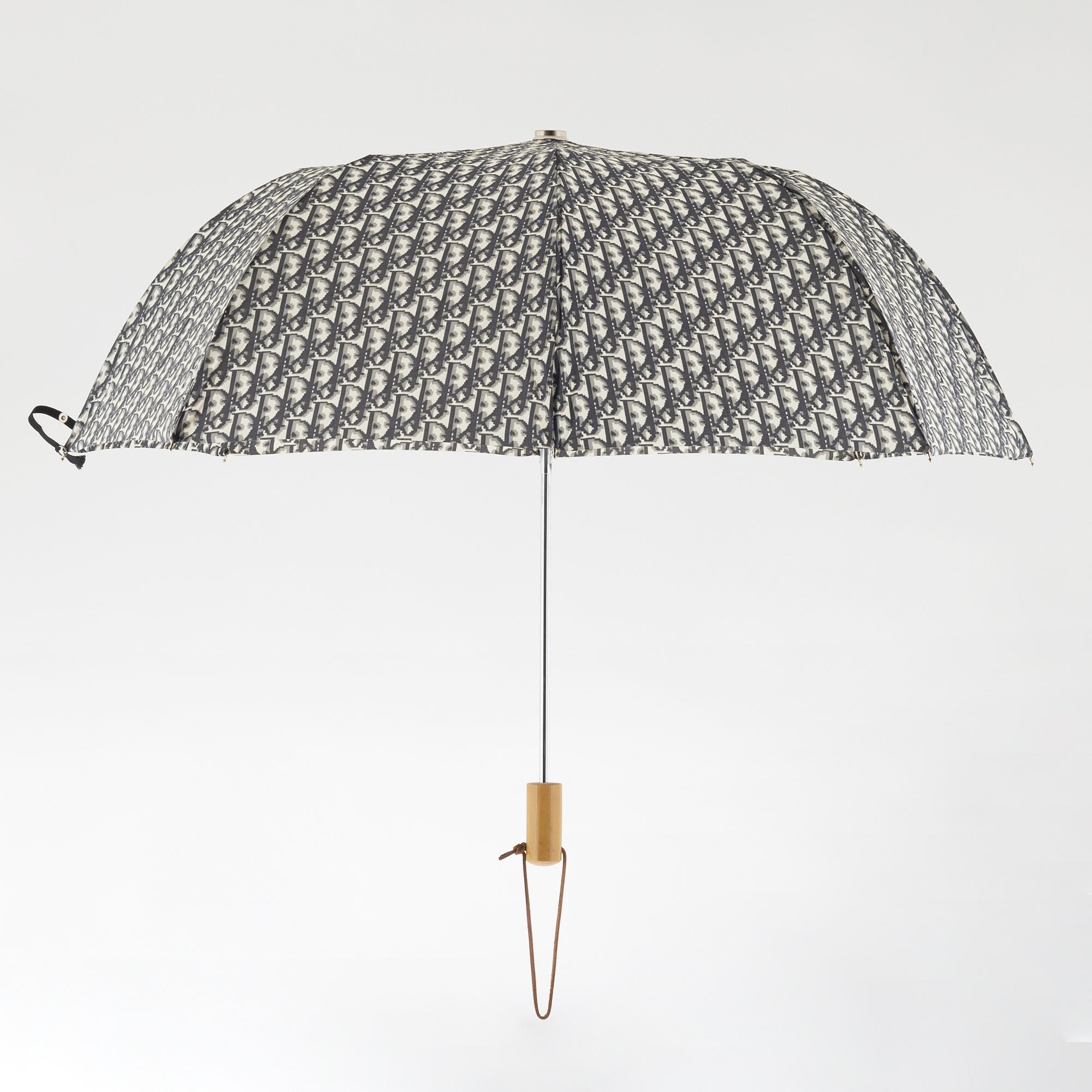 Christian Dior, a canvas weekend bag and umbrella.