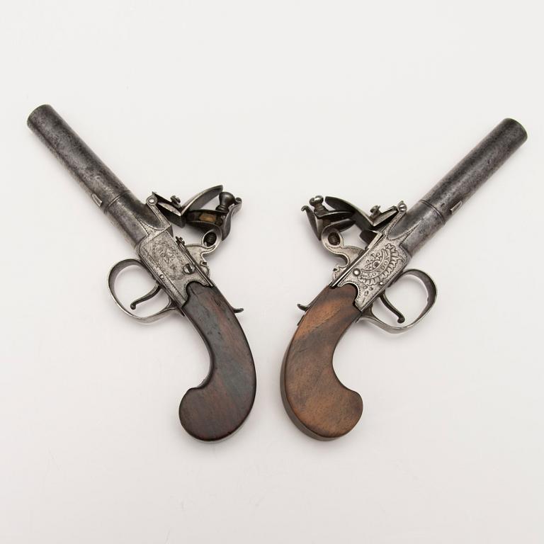 A pair of english boxlock flintock pistols marked E. Bond London, circa 1800.