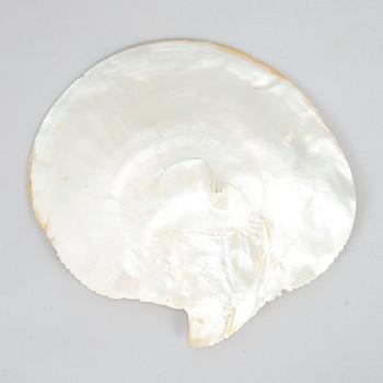 A carved mother-of-pearl shell, late Qing dynasty.