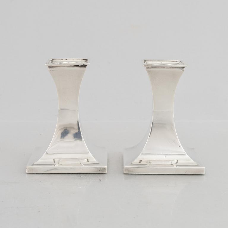 A pair of silver candlesticks, mark of William Hutton & Sons Ltd, Sheffield 1911-1912.