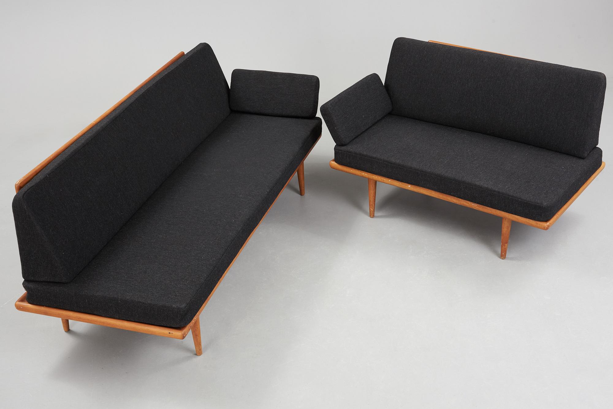 A set of two Danish 'Minerva' sofas with a table for France & Daverkosen.
