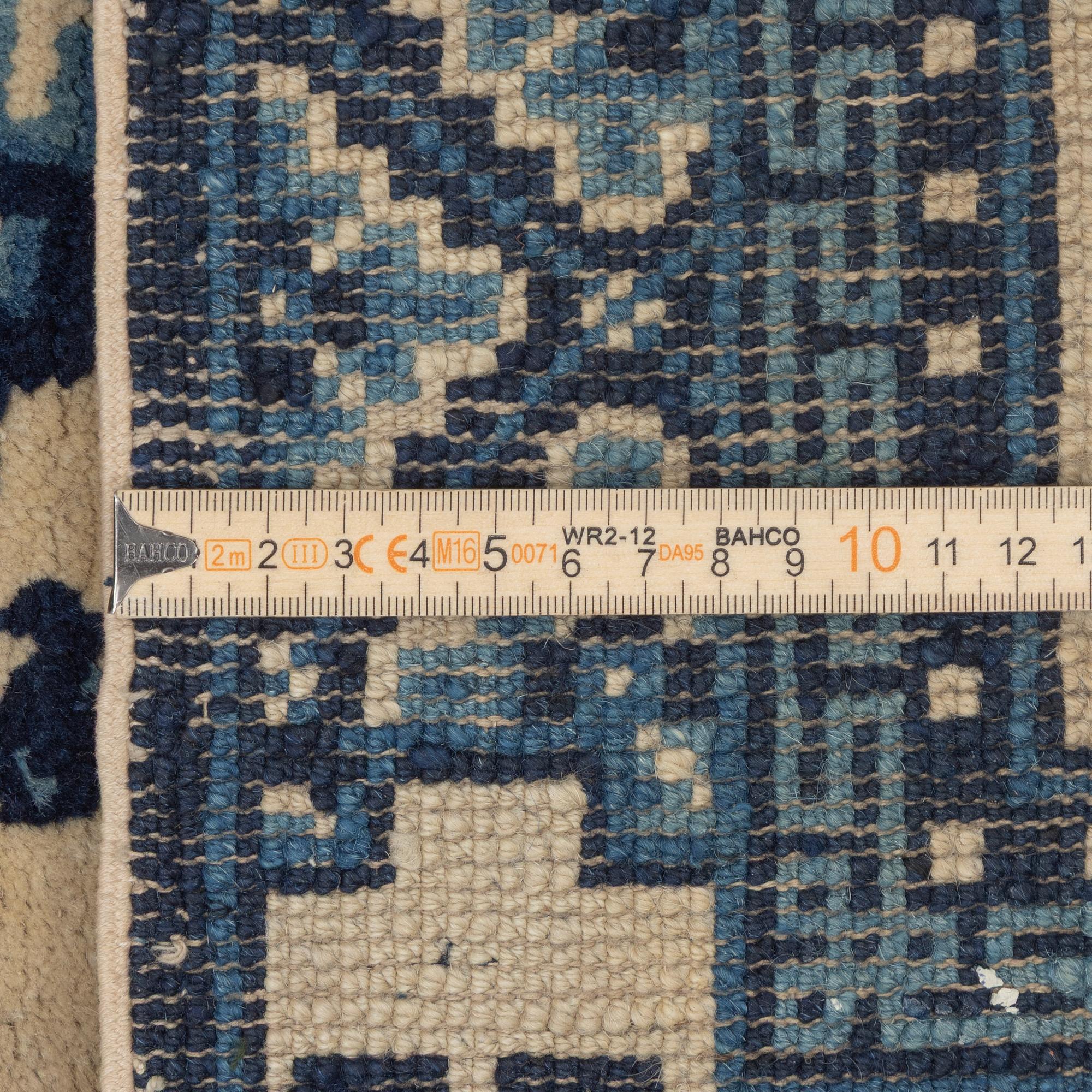 Two antique Chinese Pao-Tow rugs, c. 125 x 65 and 125 x 60 cm.