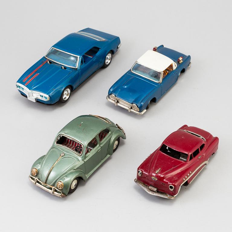 A lot of four tinplate toy cars by Bandai and Marusan, Japan, 1950/60s.