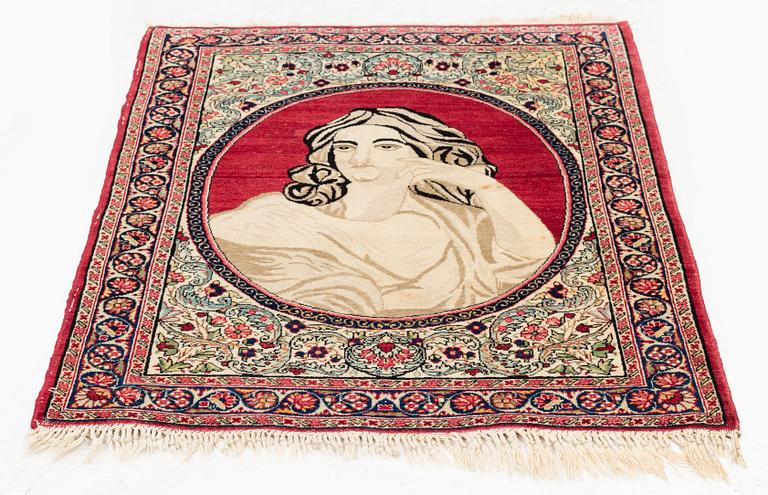 An antique pictoral Kerman Raver rug, c. 87 x 65 cm.