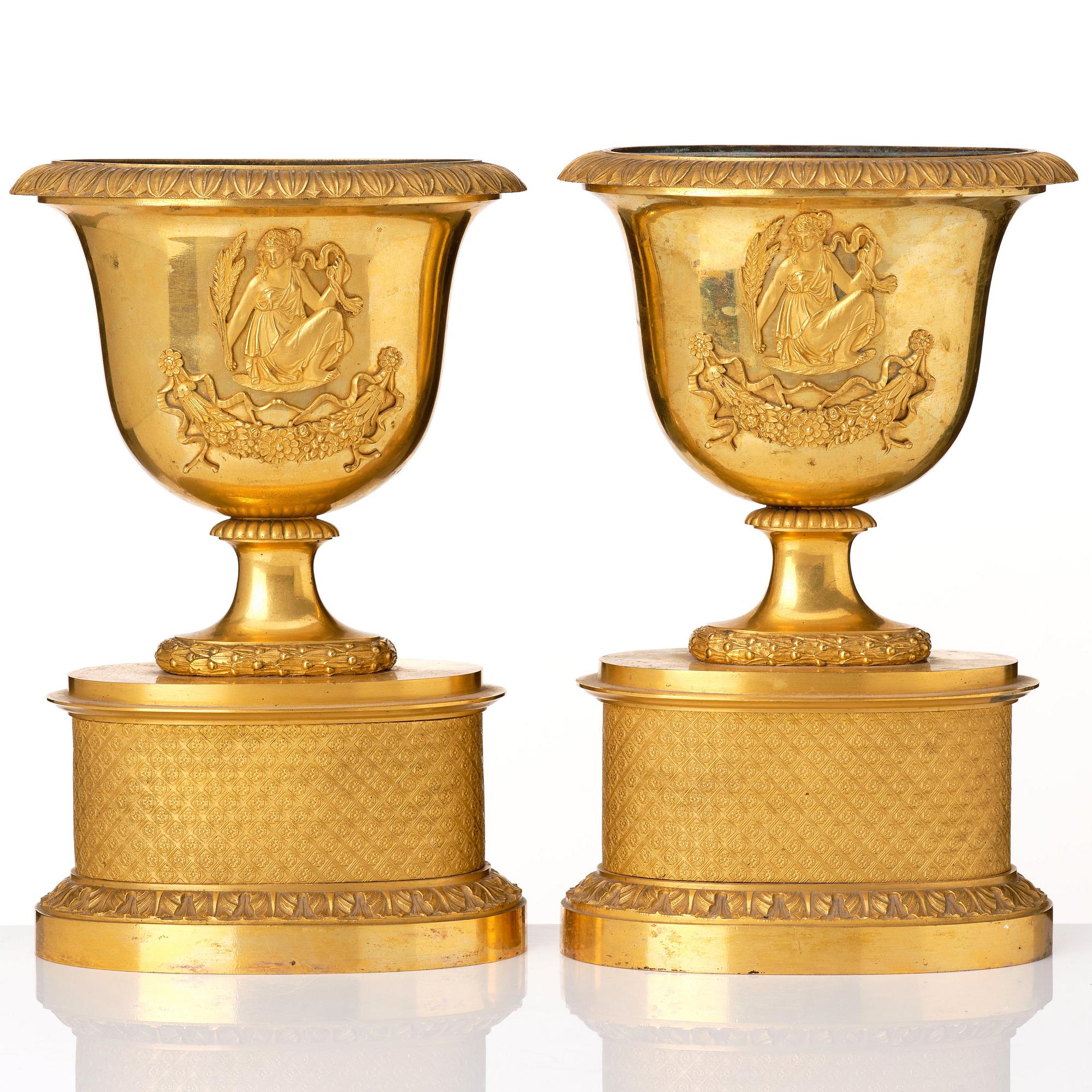 A set of three French Empire early 19th century gilt bronze centre pieces.