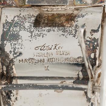 Four shakers in a pair of miniature rickshaws, sterling silver, maker's mark of Wai Kee, Hong Kong.