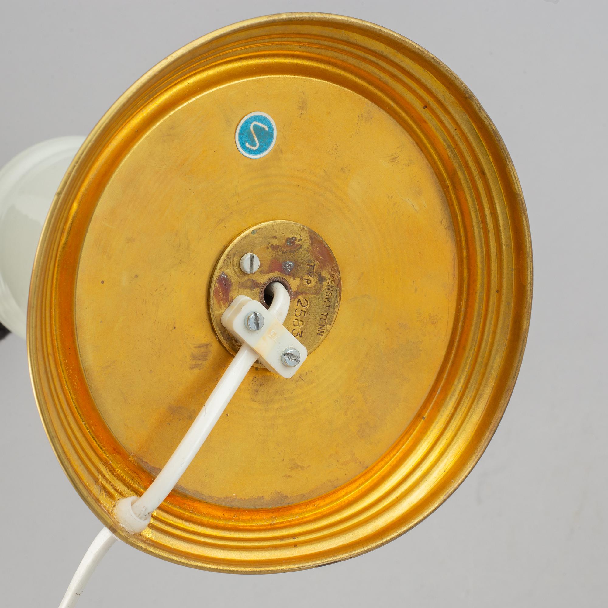 A brass and glass table lamp with lamp-shade. Svenskt Tenn, model no. 2583.