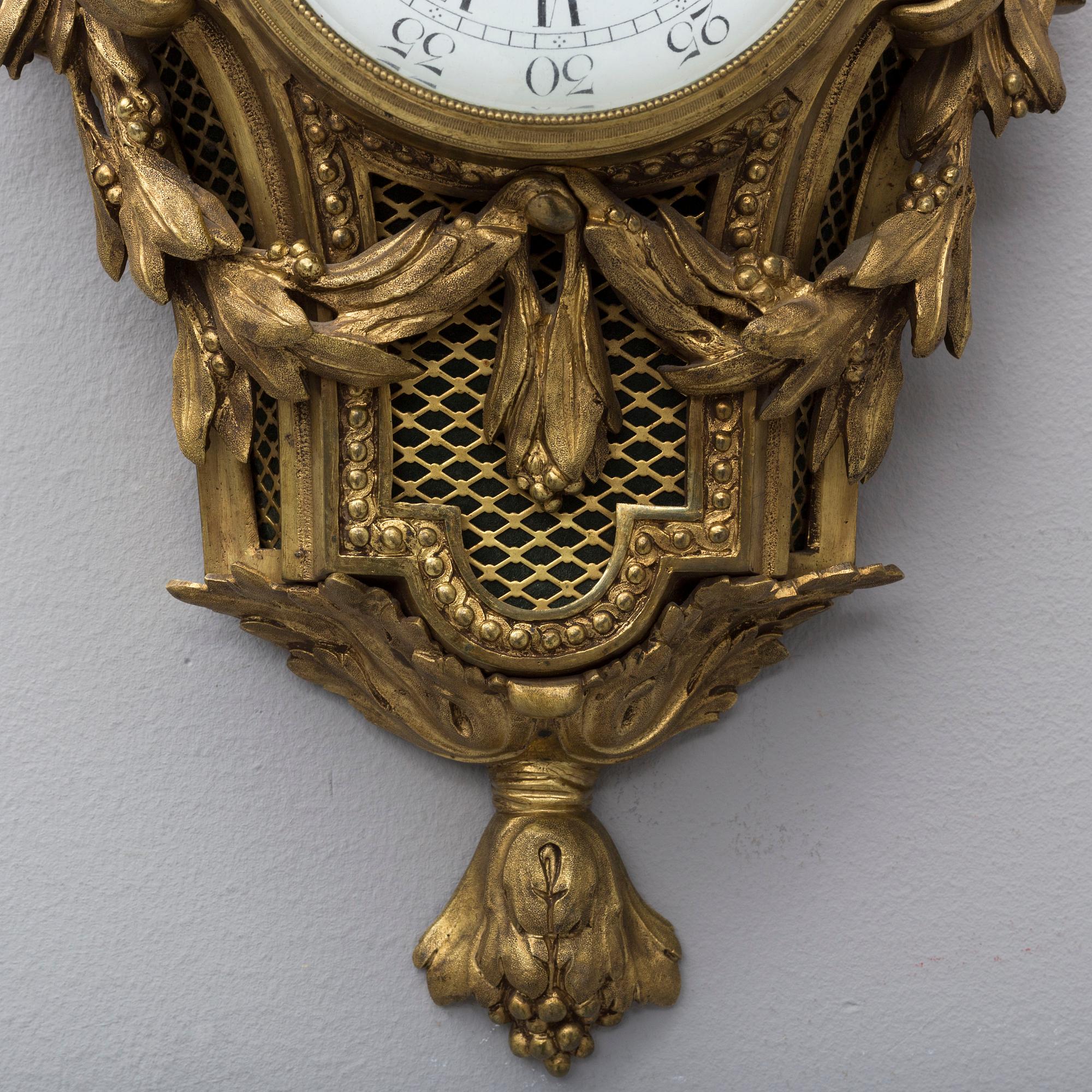 A brass wall clock marked A.W. Bruuns eftr, Lund from around year 1900.