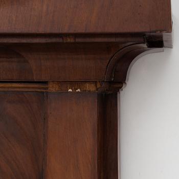 A first half of the 19th century mahogany mirror with console table.