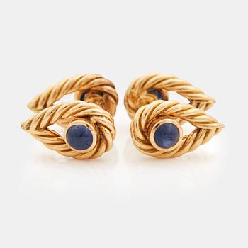 867. A pair of cabochon-cut sapphires cuff-links.