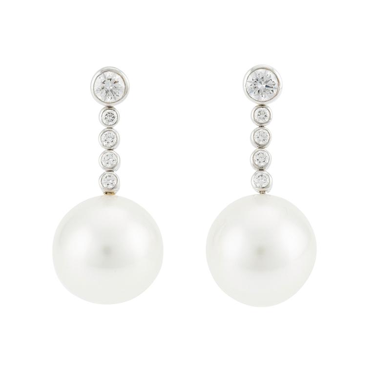 A pair of Tiffany & Co  platinum earrings with cultured pearls and round brilliant-cut diamonds.