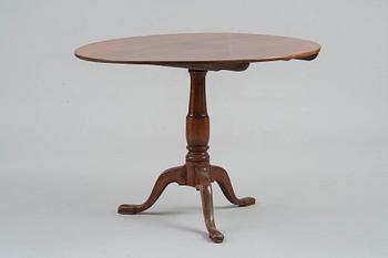 A TILT-TOP TABLE.