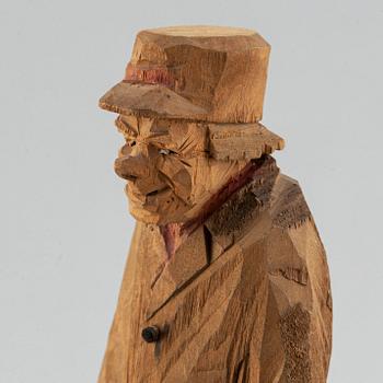 Four Carl Johan Trygg wooden sculptures, two signed and dated 1918.