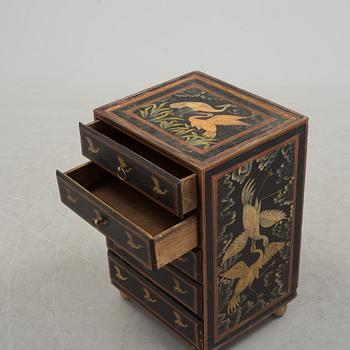 A 20th century oriental drawer.